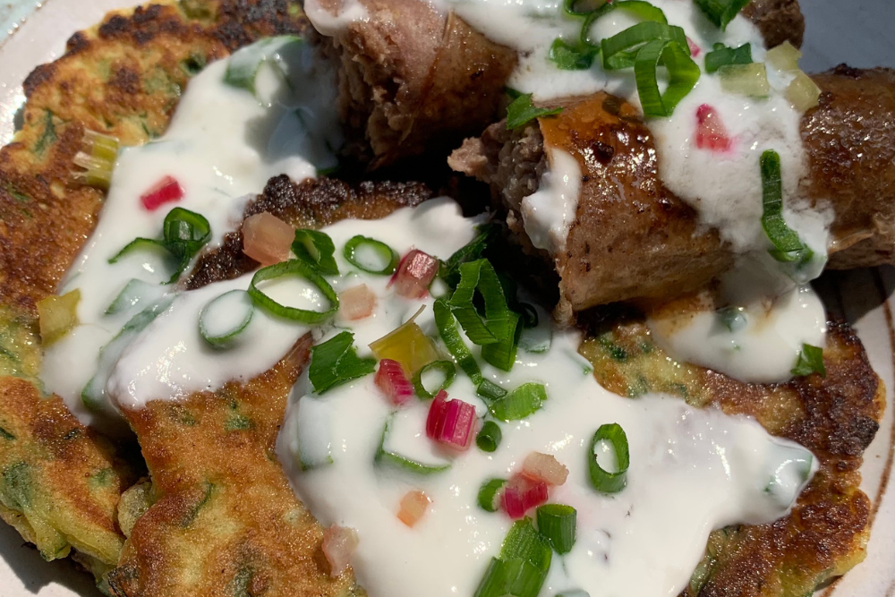 Brats with Swiss Chard Pancakes and Yogurt Sauce