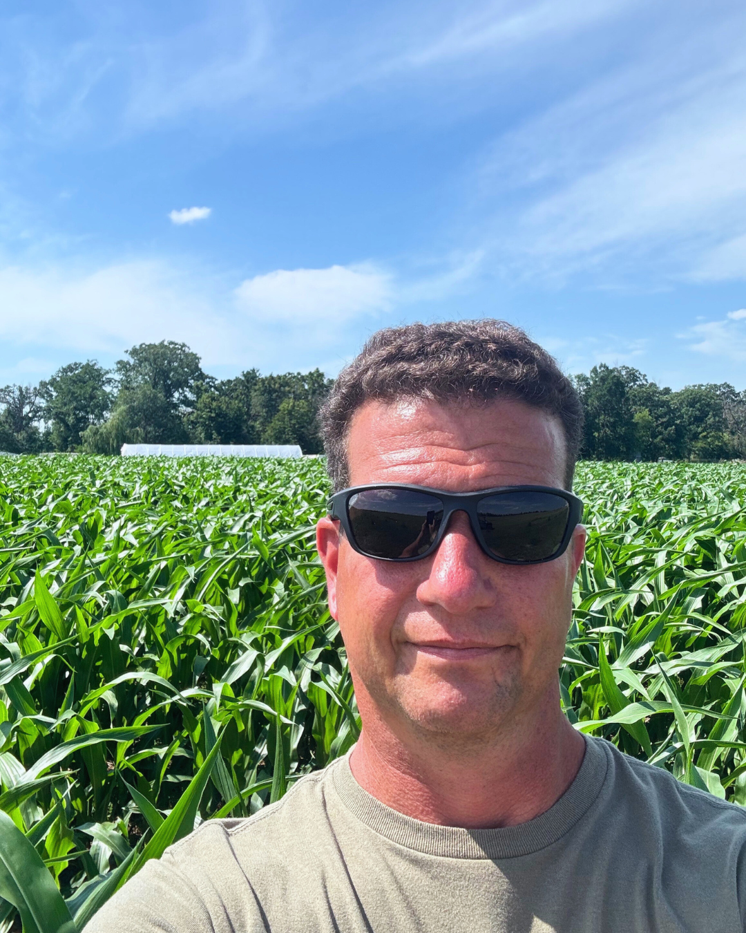 Greg Fox standing in front of corn field