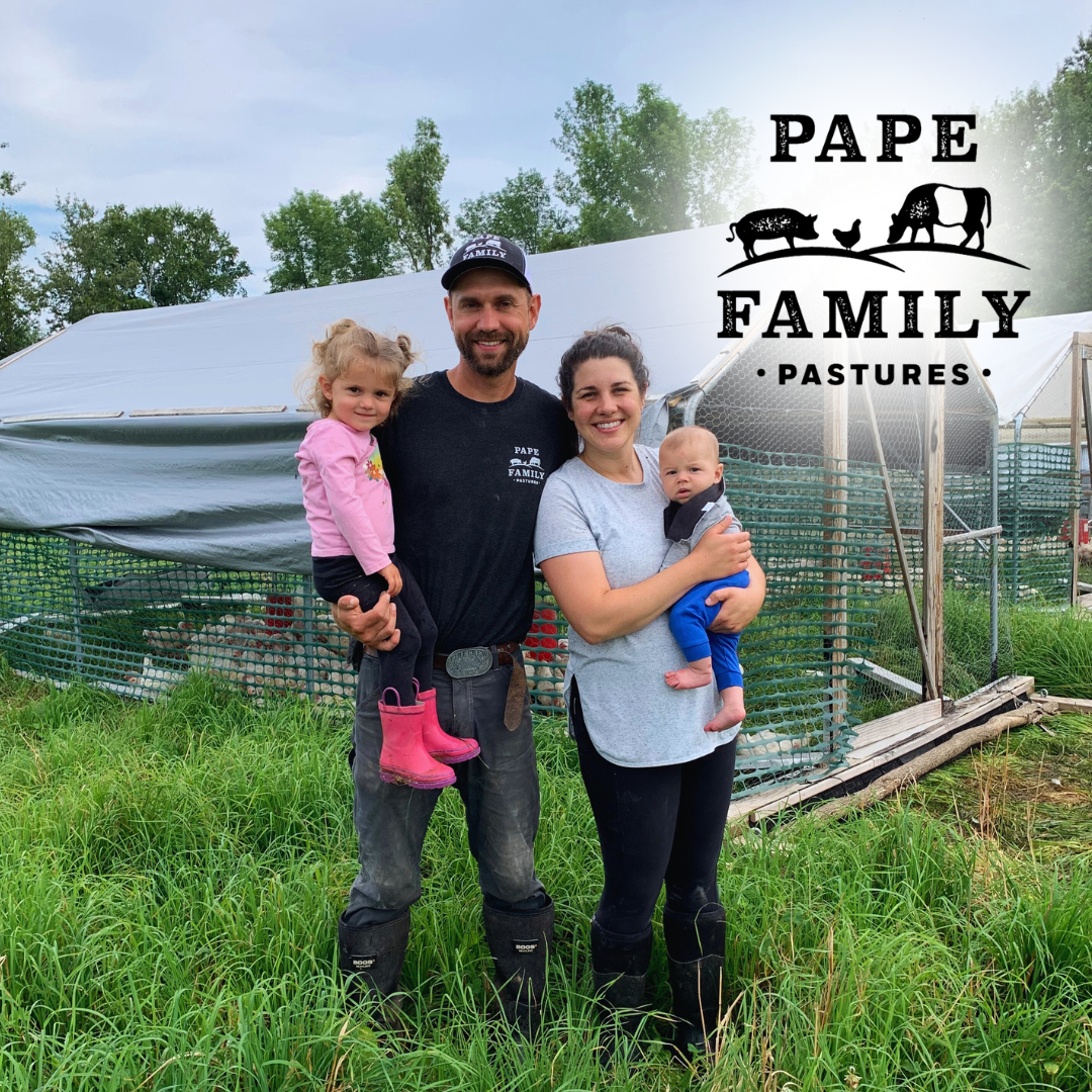 Pape family standing in pastures in front of chicken tractors