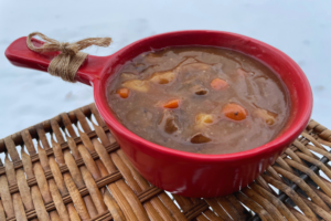 Beef Stew in red bowl with handle