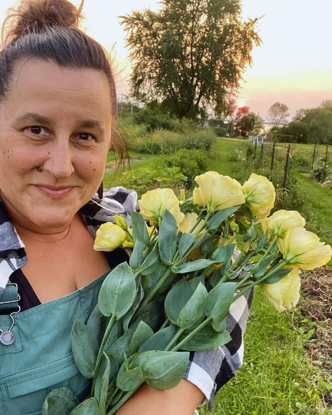 Sarah Valentine holding bouquet of yellow flowers