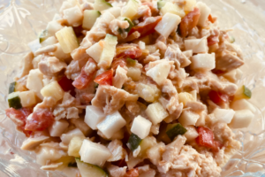 Chopped chicken salad in glass bowl