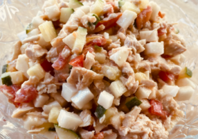 Chopped chicken salad in glass bowl