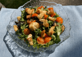 salad with croutons in glass bowl